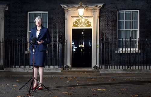 UK Prime Minister Theresa May announces outside 10 Downing Street that she has the support of her cabinet for Britain's Brexit deal with the EU.