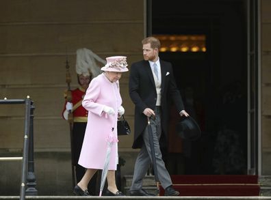 Queen walking with Prince Harry