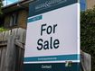 A for sale sign on a home.