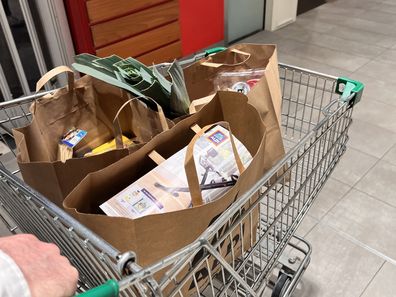 shopping bags at supermarket groceries coles woolworths aldi 