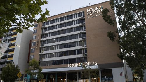 A security guard who contracted COVID-19 at the Four Points by Sheraton hotel was not wearing a mask.