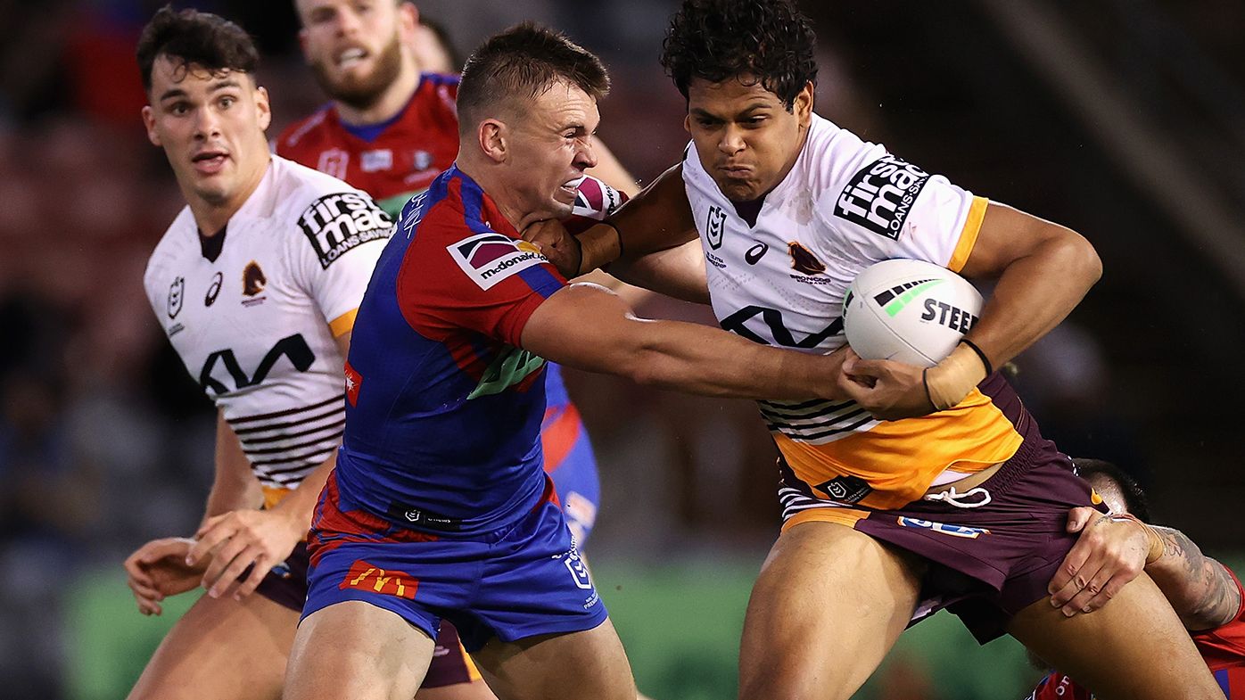 Selwyn Cobbo of the Broncos is tackled during the round 11 NRL match between the Newcastle Knights and the Brisbane Broncos.