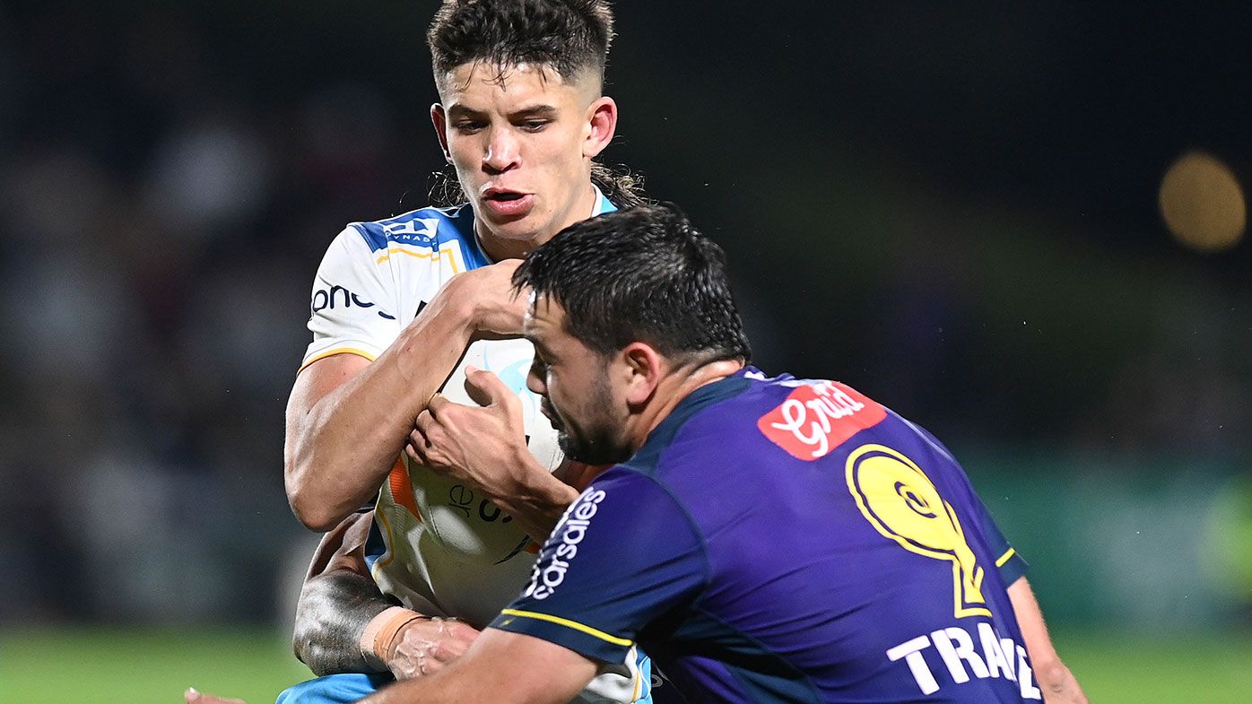 Jayden Campbell of the Titans is tackled by Brandon Smith of the Storm during the round 13 NRL match between the Melbourne Storm and the Gold Coast Titans at Sunshine Coast Stadium.
