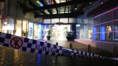 NSW police tape surrounds the entrance to Westfield Bondi Junction on Oxford Street on April 13, 2024.