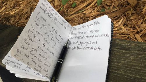 A tribute for Justine scrawled in a community notebook. (9NEWS)