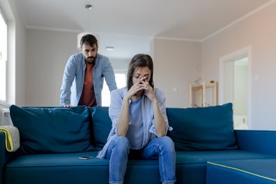 Angry Fury Man Screaming at Woman. Angry Couple Having an Argument in Their Living Room. Young Marriage Couple Have an Argument Because of Relationship Crisis. Couple Having Argument - Conflict, Bad Relationships.