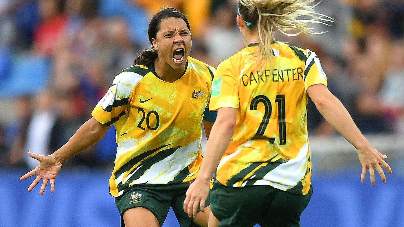 Sam Kerr and Ellie Carpenter celebrate after Australia defeated Brazil at the World Cup.