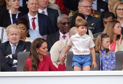 (L) Prime Minister Boris Johnson, Catherine, Duchess of Cambridge holds hands with Prince Louis of Cambridge during the Platinum Pageant on June 05, 2022 in London, England.  