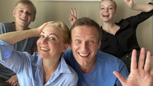 Russian opposition activist Alexei Navalny, foreground right, his wife Yulia, foreground left, his daughter Daria, right, and son Zakhar pose for a selfie.