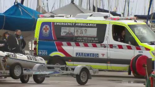 The man, who is yet to be identified, could not be revived after falling from the yacht. (9NEWS)