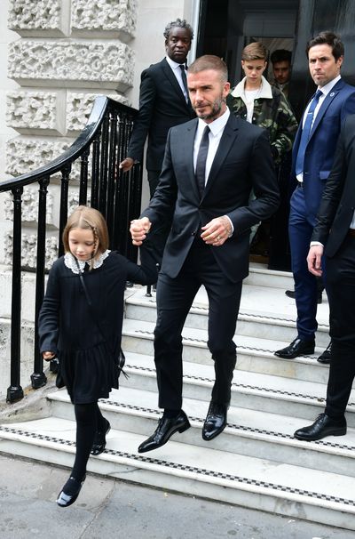 David Beckham and his children Harper (left), Romeo (camouflage jacket) and Brooklyn (rear, behind Romeo) leave after attending the Victoria Beckham London Fashion Week SS19 show in Dover Street, London.&nbsp;