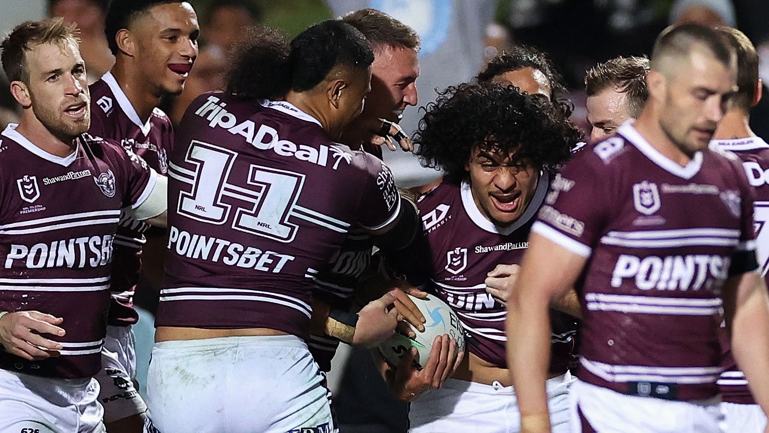 Christian Tuipulotu celebrates scoring a try during the round 16 NRL match between Manly and the Storm.