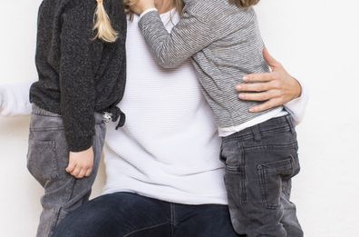 Woman holding children