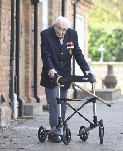 99-year-old war veteran Captain Tom Moore, poses for a photo at his home in Marston Moretaine, England, after he achieved his goal of 100 laps of his garden