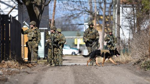 Law enforcement officers search for a suspect involved in a shooting at a Central Michigan University residence hall. (Image: AAP)