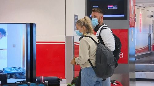Passengers from Adelaide flight arrive in Sydney.