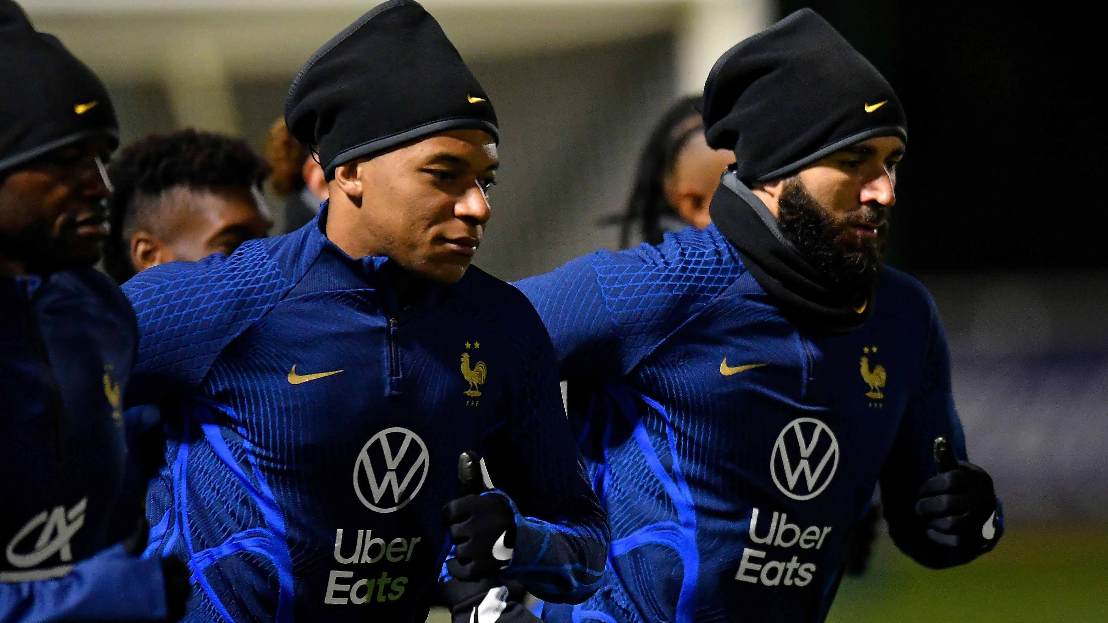 Kylian Mbappe and Karim Benzema warm up during a France training session on November 15.
