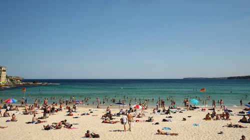 Parts of New South Wales and Queensland hit by 36-hour heatwave