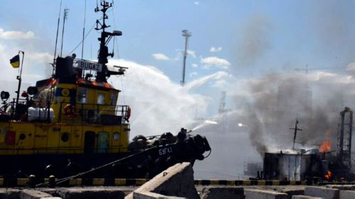 Firefighters put out a fire in the port after a Russian missiles attack in Odesa