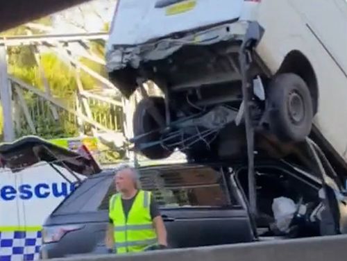 The dramatic crash, left the van teetering in the air on top of the other vehicle.It happened at Moore Park, on the edge of Sydney's CBD, and caused long queues for traffic heading out on Boxing Day afternoon.﻿