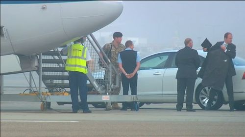 The prince prepares to board a RAAF jet to Canberra. (9NEWS)