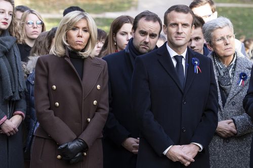 Emmanuel Macron yesterday with wife Brigitte Macron walking with officials to the Douamont National Necropolis and Ossuary as part of ceremonies marking the centenary of the First World War.