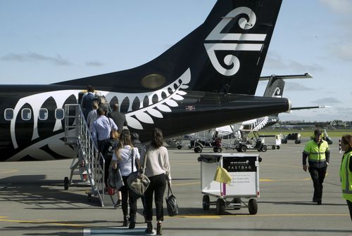 Passengers on board an Air New Zealand flight were frustrated by a woman who deliberately ignore directions from the flight crew to pay attention to the safety briefing.