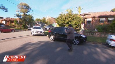 Cars line up for school pick up around Zach Dent's home.