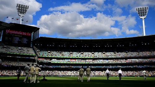 Australia walks out to begin play during day two of the Third Test match in the Ashes series between Australia and England at Melbourne Cricket Ground.