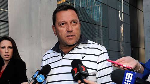 Louie Naumovski, a spokesperson for the families of the victims of fire, leaves the Magistrates Court in Brisbane on June 26. (AAP)