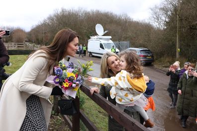 Ahead of St. Davids Day, The Prince and Princess of Wales  visited  Brynawel Rehabilitation Centre, in Llanharan, Pontyclun Wales. Cora Phillips gives The Princess flowers with her mum Michelle Phillips
