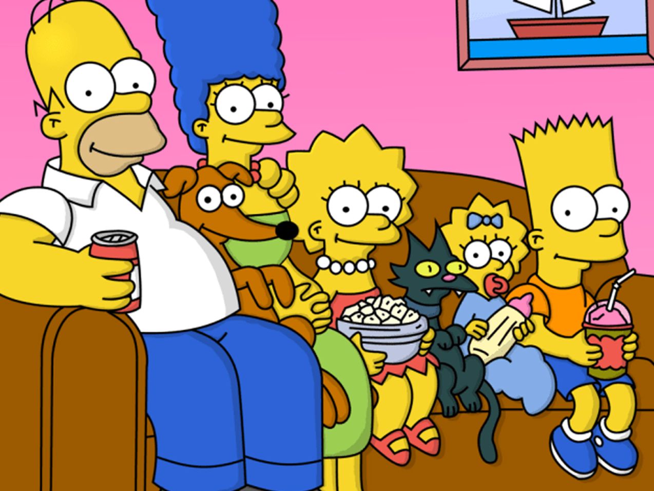 The Simpsons family sit on their couch. 