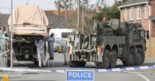 Chemical weapons experts search the crime scene in Salisbury. (AP).