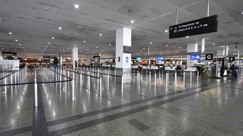 Empty baggage check-in lines inside in International terminal at Tullamarine Airport, Melbourne.