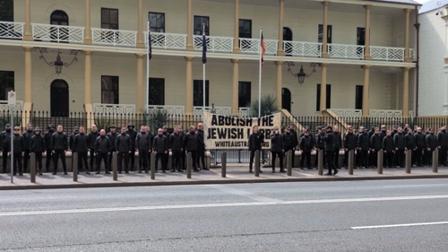 Transport for NSW has stood down a frontline employee after he attended a roughly 60-member strong neo-Nazi rally outside Parliament House. 