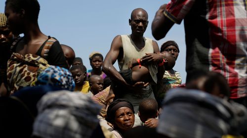 Refugees, such as those pictured in this photo on Lake Tanganyika in 2015, once fled Burundi's political violence. Now, they are trying to escape natural disasters.