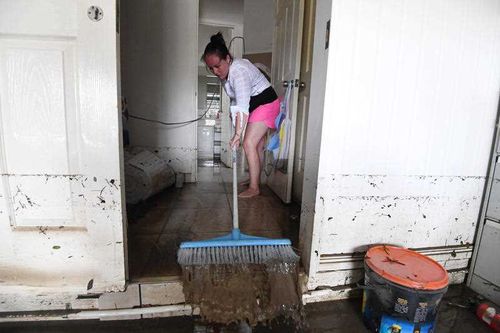 Homes are filled with mud from the water.