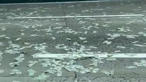 Money was scattered across the California highway. 