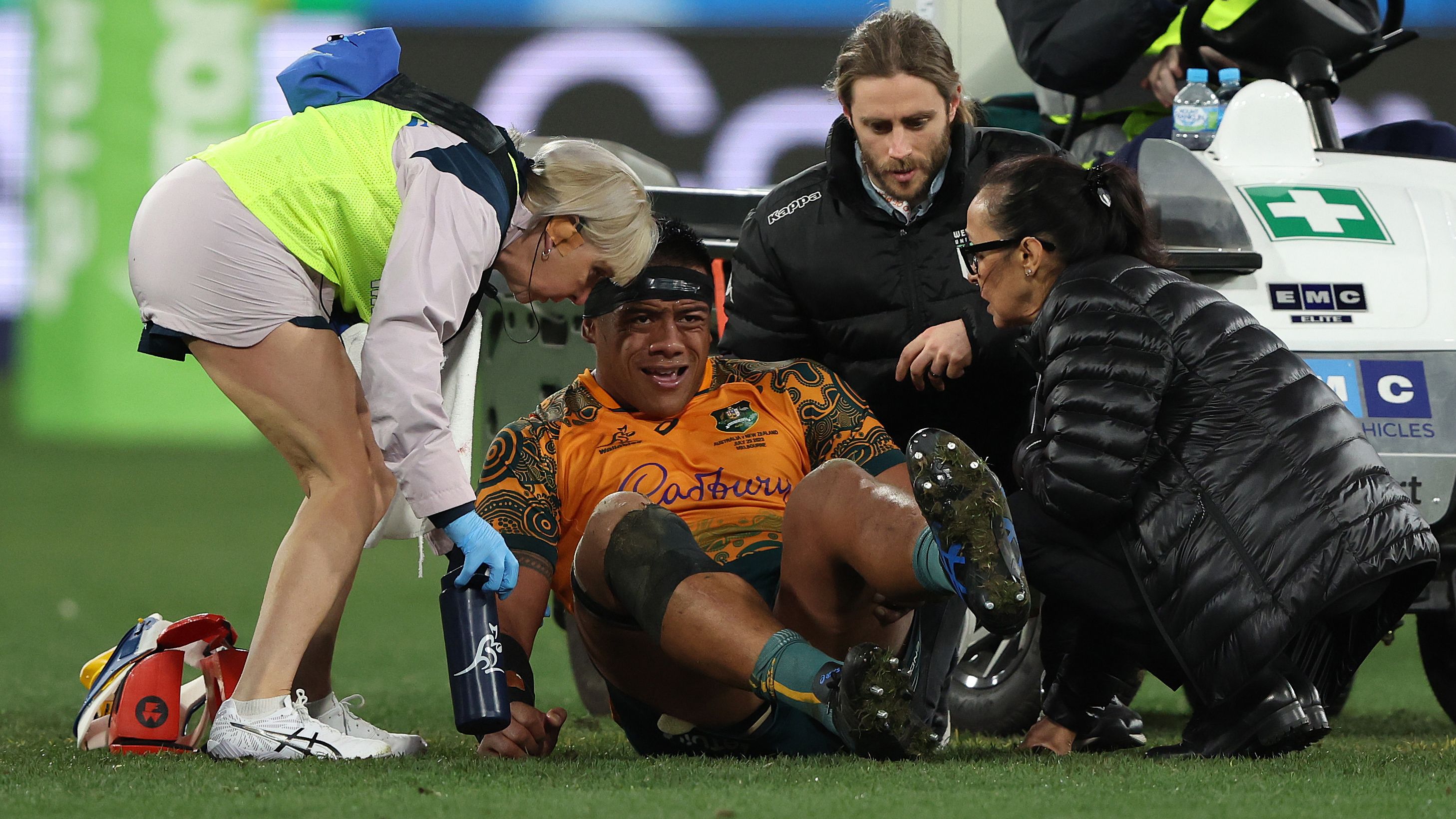 Allan Alaalatoa of the Wallabies comes off the ground with an injury.