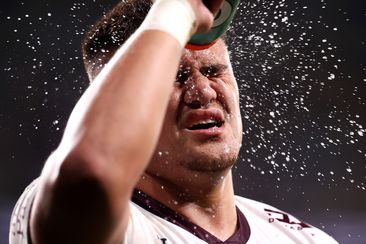 Josh Schuster of the Sea Eagles sprays water on his face in a break of play in their round 11 match against the Eels. 