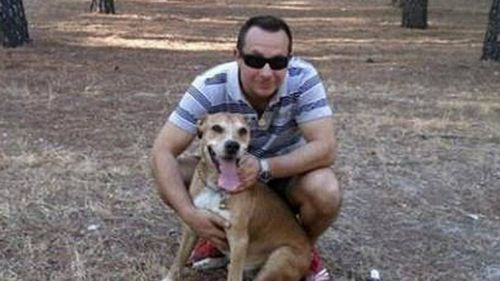 Javier Limon, husband of Ebola-infected nurse Teresa Romero, and their dog Excalibur. (AAP)