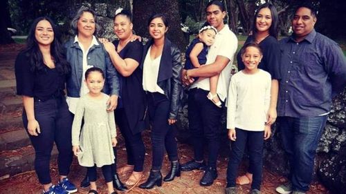 Jazmin Hunter, in the white shirt and black jacket, with family including mum Barbara Hunter, second from left.
