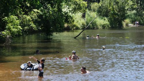 The Bunya Crossing Reserve was a popular place to cool off on January 9. (AAP)