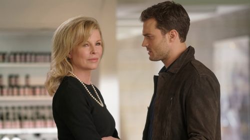 im Basinger as Elena Lincoln, left, and Jamie Dornan as Christian Grey in "Fifty Shades Darker". (Universal Pictures)