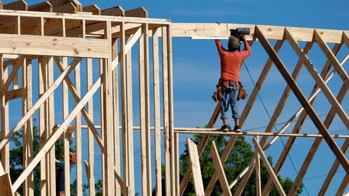 A carpenter builds a home