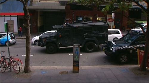 Vehicles including riot trucks and an armoured bearcat are on the scene. (9NEWS)