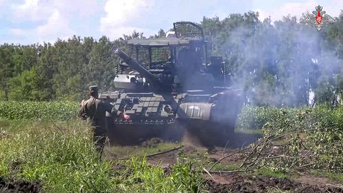 In this photo taken from video released by the Russian Defense Ministry on Saturday, Aug. 10, 2024, a Russian Army tank takes a position at an area of Kursk region of Russia. (Russian Defense Ministry Press Service via AP)