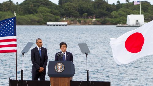Abe and Obama speak in front of the Pearl Harbour memorial. (AFP)
