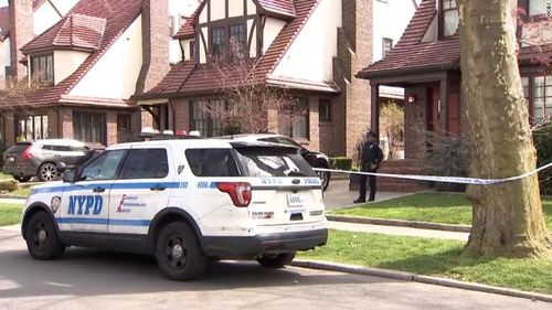 Police officers are pictured outside the home of Orsolya Gaal.