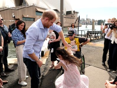 Prince Harry, Duke of Sussex dances with Charlotte Vanderzwan, after being presented with custom thongs by Invictus Australia veteran Joel Vanderzwan at the Sydney Opera House on April 17, 2026 in Sydney, Australia. 